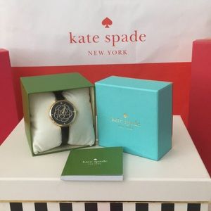 New. Watch has black leather band in original box